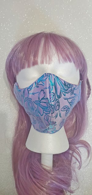 Image of metallic blue rose . reversible mask