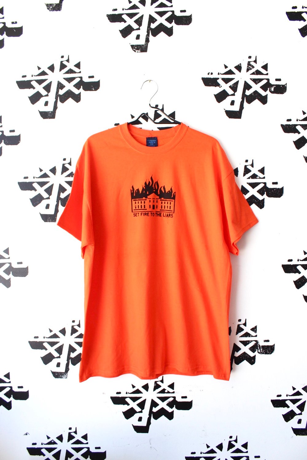 set fire to the liars tee in orange 