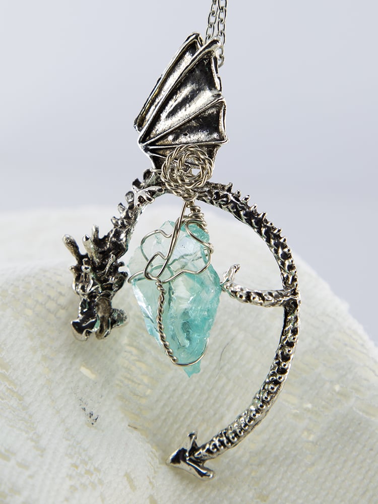 Image of Dragon Pendant with Aura Quartz wrapped with silver and silver spiral wrap.