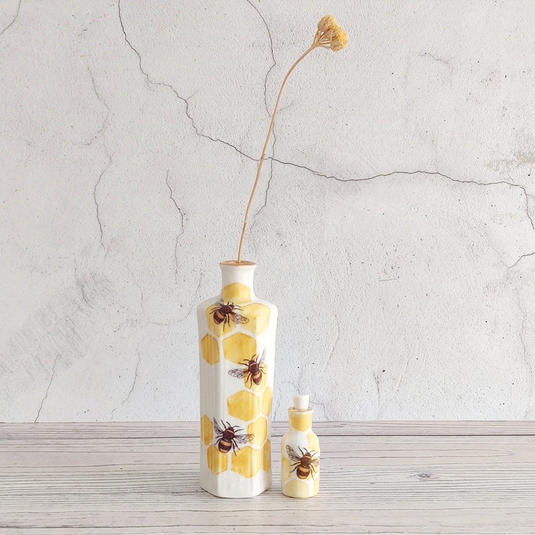 Tall porcelain hexagonal bee bottle