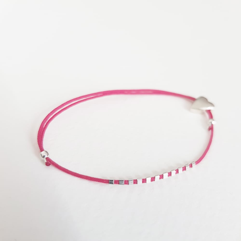 Image of COLETTEmini silver heart on fuchsia