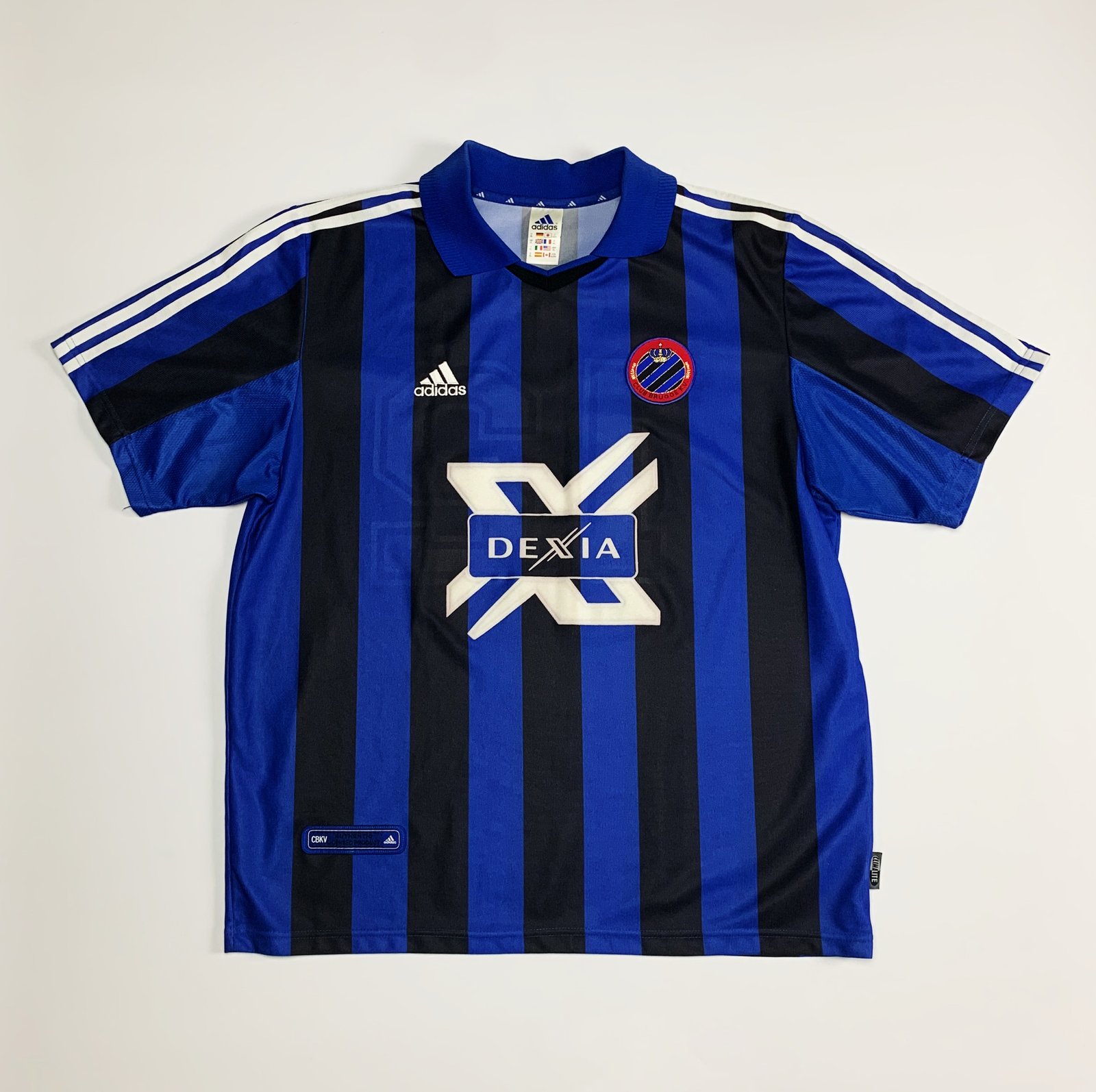 CLUB BRUGGE'S NEW HOME JERSEY, BLACK AND BLUE WITH GOLD ACCENTS