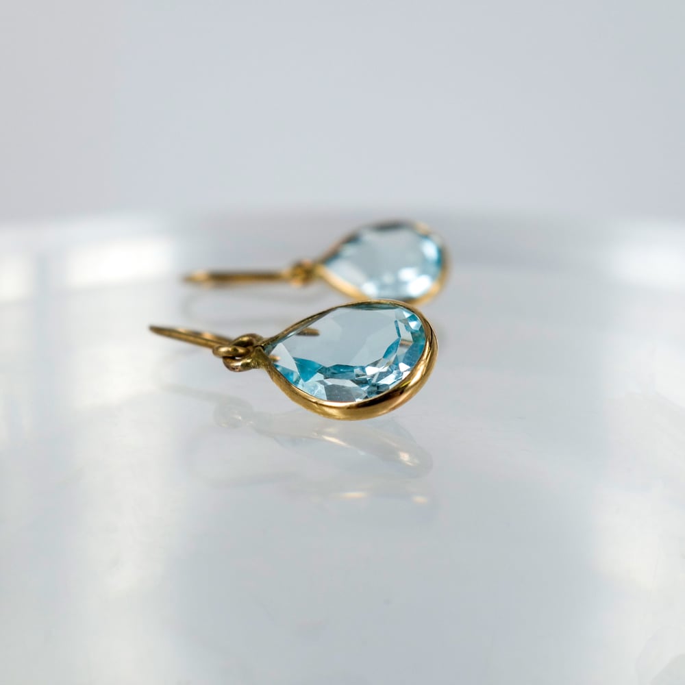 Image of E1794 - 9ct yellow gold pear shaped drops with Icey blue Topaz
