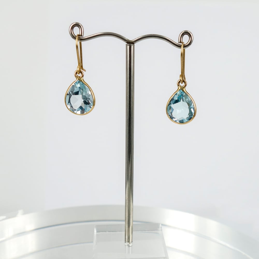 Image of E1794 - 9ct yellow gold pear shaped drops with Icey blue Topaz