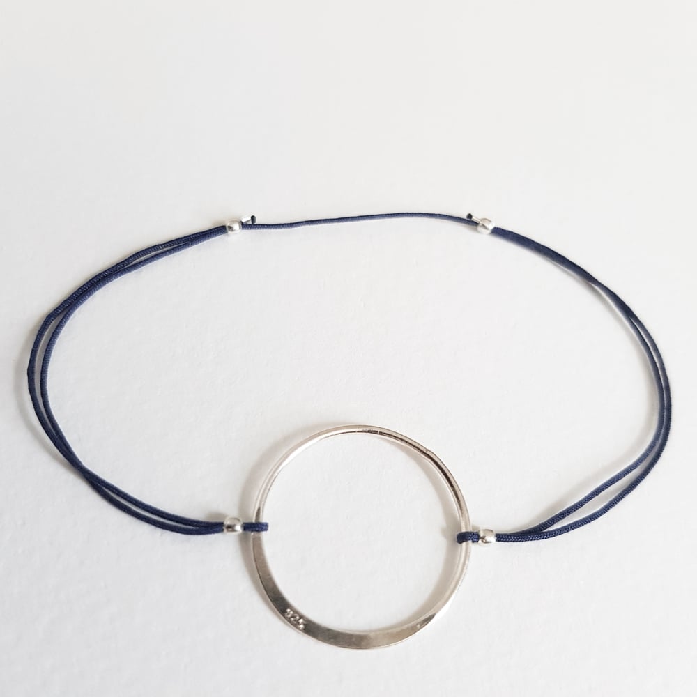 Image of ADELINE big circle on navy blue
