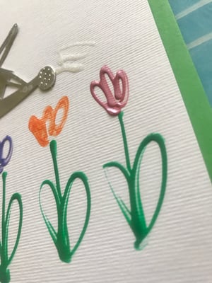 Image of Watering Flowers