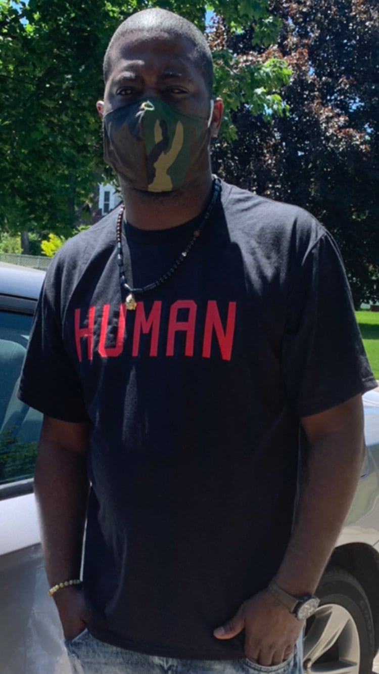 Image of “Human” T | Black T shirt Red Text