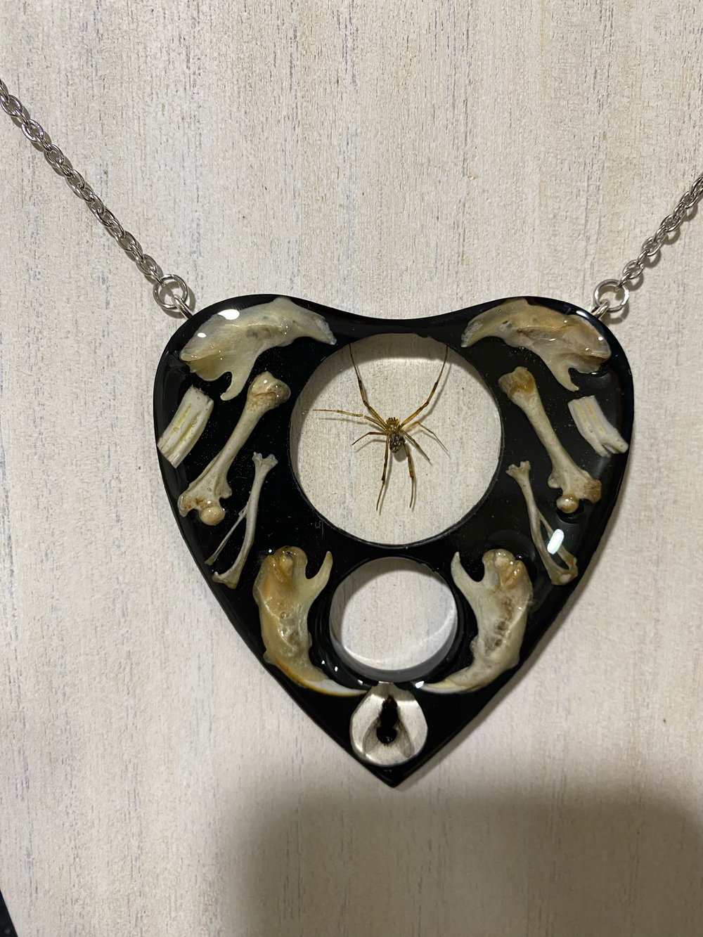 Juvenile black widow and bone oujia planchette pendant 