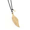 Reserved . 14k gold feather necklace with white sapphire 