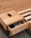 FLOATING BED WITH CLIPPED WING DRAWERS IN TASMANIAN OAK