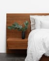 FLOATING BED WITH CLIPPED WING DRAWERS IN TASMANIAN BLACKWOOD