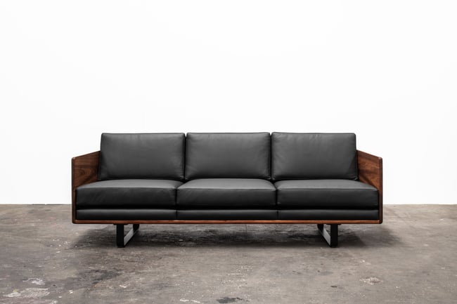 CLOVER COUCH IN TASMANIAN BLACKWOOD WITH  BLACK LEATHER