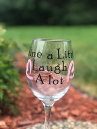 Wine glass “wine a little, laugh a lot”