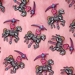 Image of Skeleton Carousel Horse enamel pin - undead - creepy cute - pastel goth - spooky - lapel pin badge