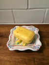 Yellow soap dish with raised coils