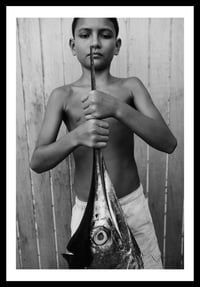 Image 1 of Boy and Marlin.  French Polynesia. 2010