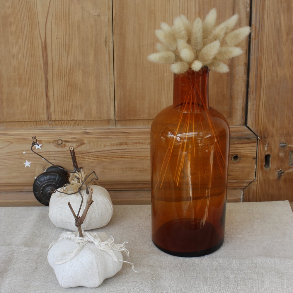 Image of Ancien flacon de pharmacie en verre soufflé ambré.