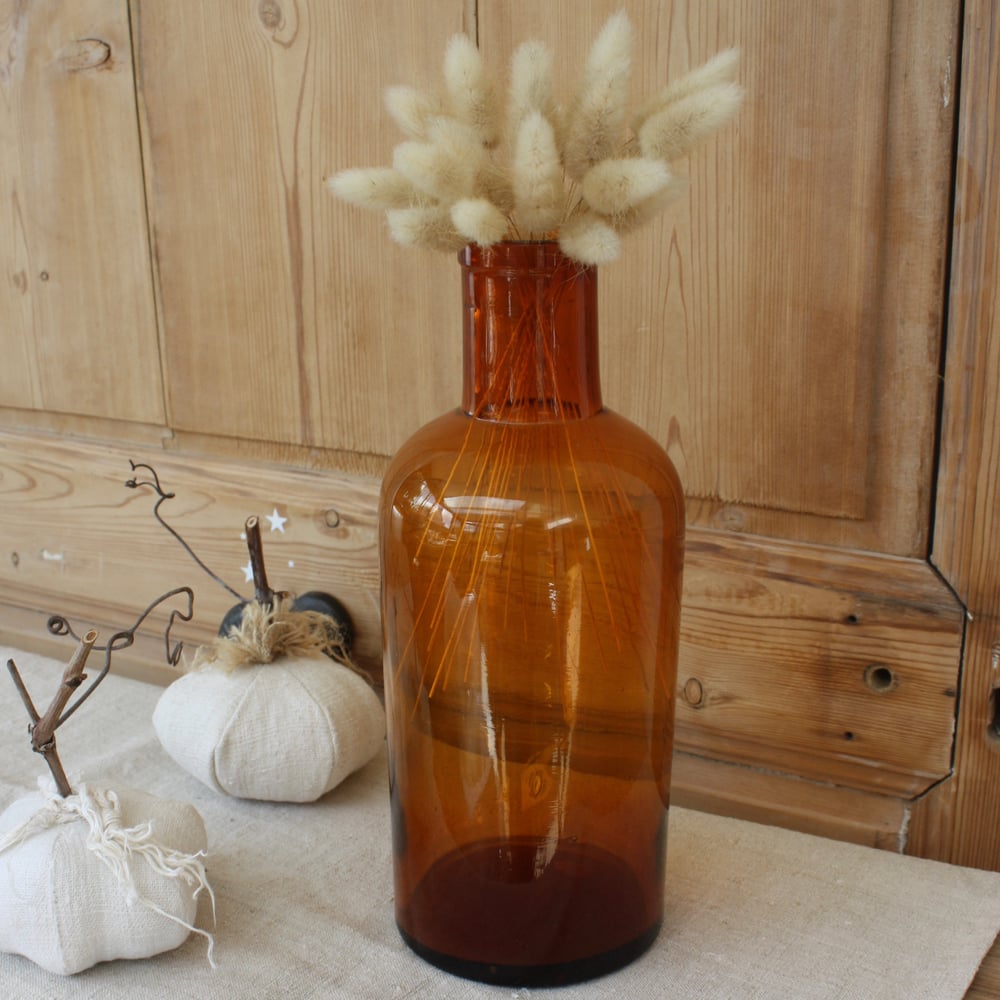 Image of Ancien flacon de pharmacie en verre soufflé ambré.
