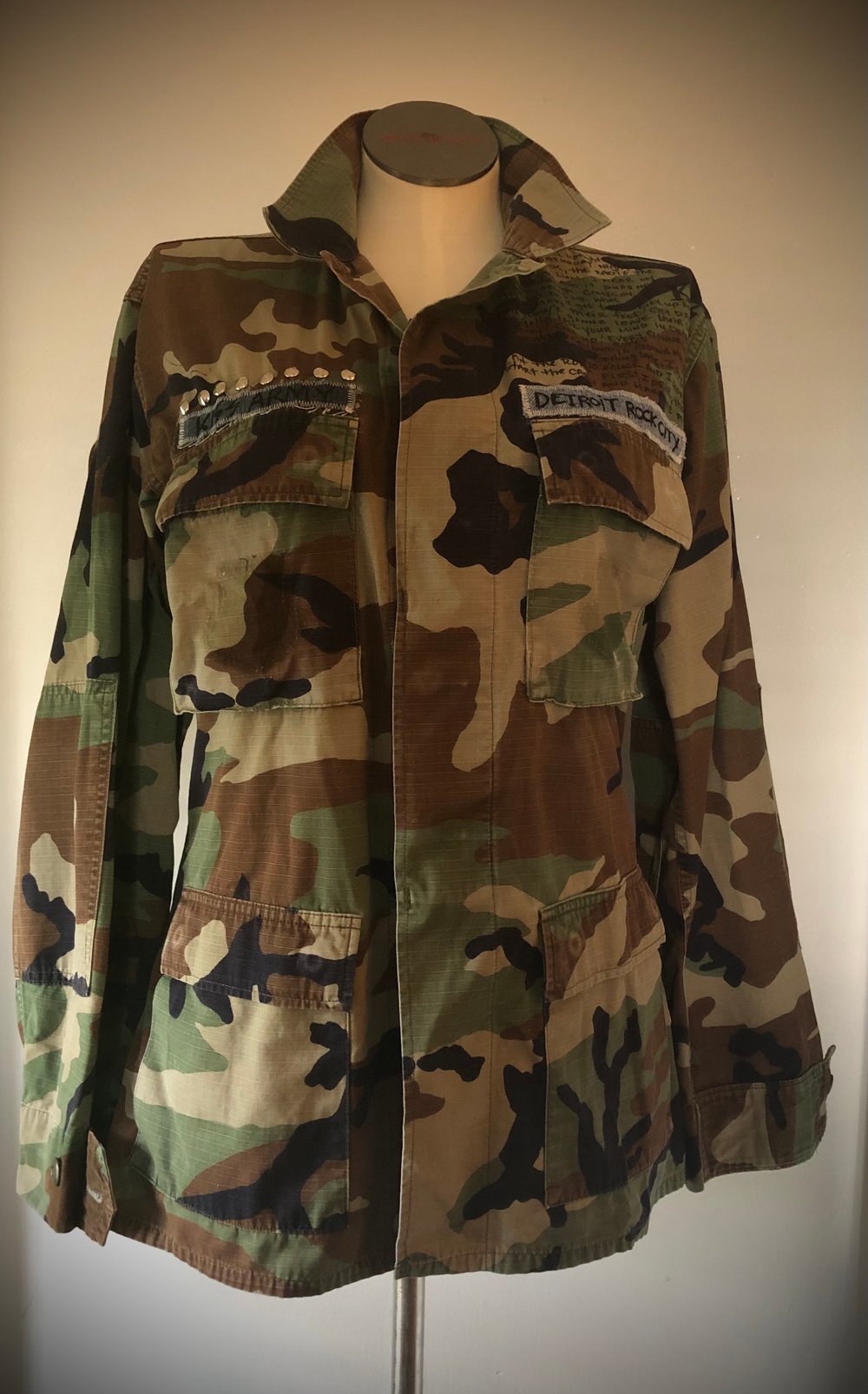 Upcycled “KISS” studded vintage army jacket 