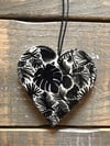 Black tropical leaves heart