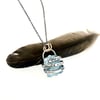 raw aquamarine necklace with coil setting