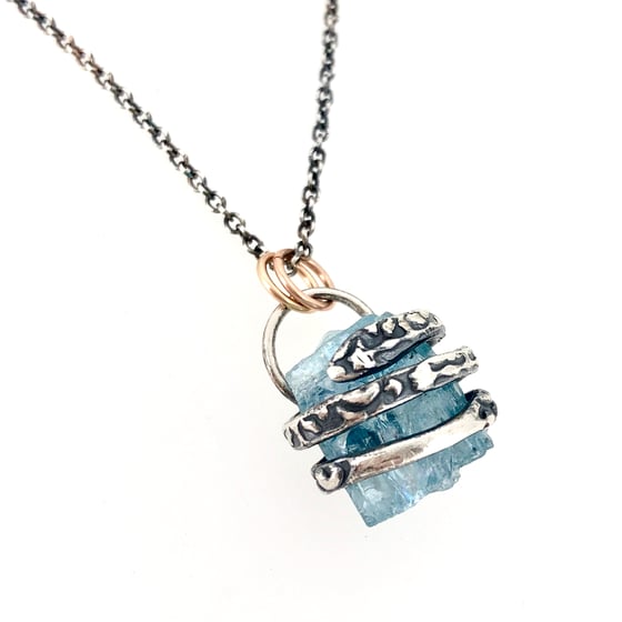 Image of raw aquamarine necklace with coil setting