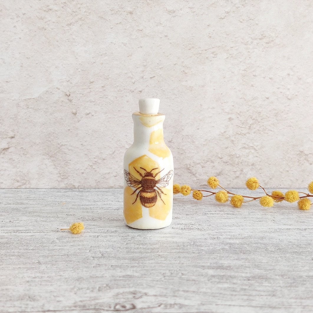 Tiny porcelain bee bottle