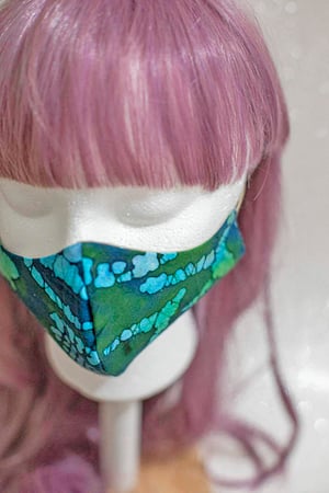 Image of green & blue tie dye . reversible mask