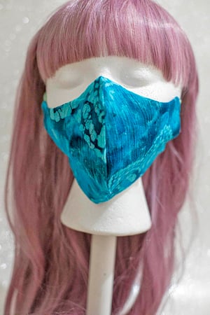 Image of blue tie dye . reversible mask