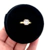 grey moissanite engagement ring in 18k gold