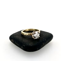 Image 1 of grey moissanite engagement ring in 18k gold