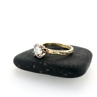 Image 3 of grey moissanite engagement ring in 18k gold