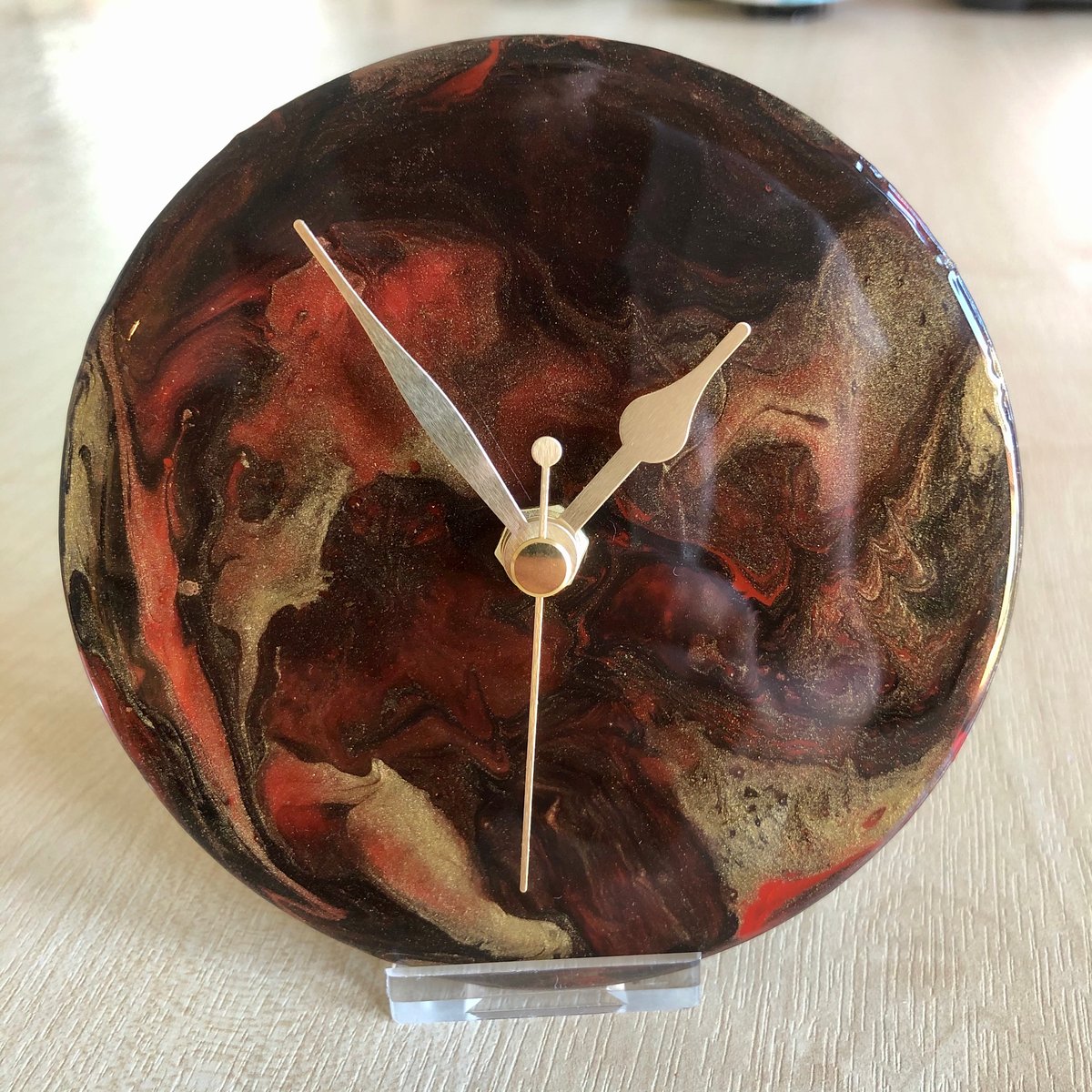 Image of  Red/Gold Metallic ‘Dragon shell’  shelf clocks with stand.