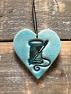 Teal needle & thread heart
