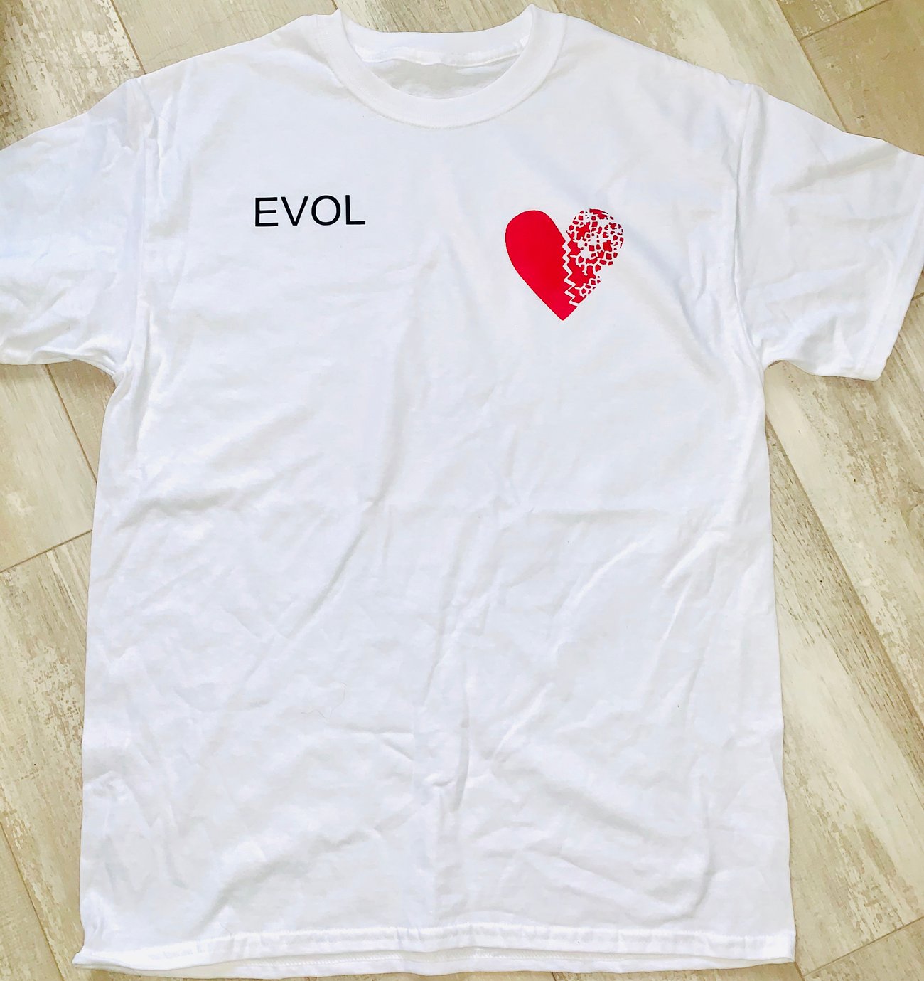 white tee shirt with red heart