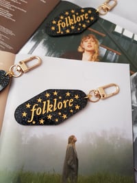 Image 4 of Folklore Acrylic Keychains (gold)