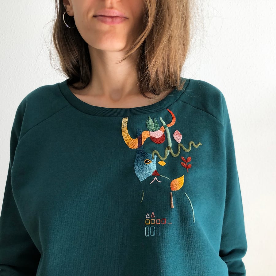 Image of Cat in a bag in a secret garden - original hand embroidery on 100% organic cotton sweatshirt