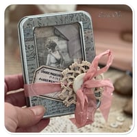 Image 1 of vintage snippet book with a window