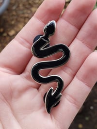 The Devil’s Dungeon enamel pin in Black