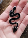 The Devil’s Dungeon enamel pin in Black