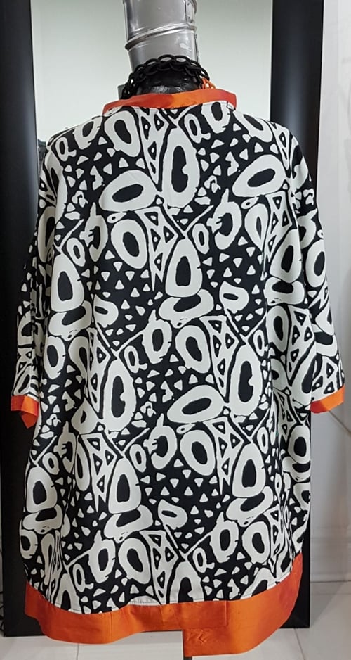 Image of oversized flowy summer top