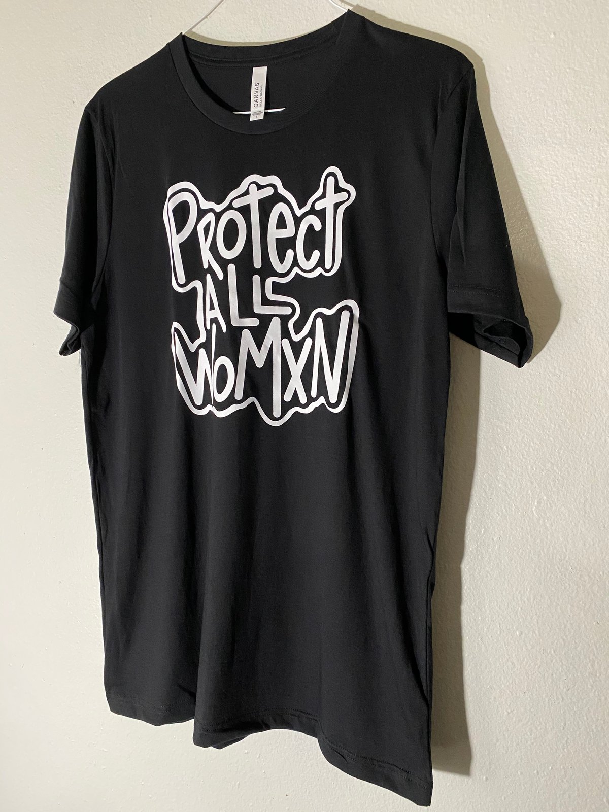Image of PROTECT ALL WOMXN UNISEX BLACK SHIRT