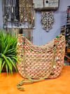 Tan straw and teal bags 