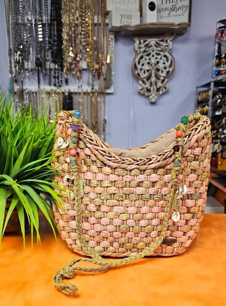Tan straw and teal bags 