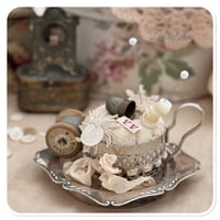 Image 1 of Handmade pin cushion sitting on a vintage silver style tray