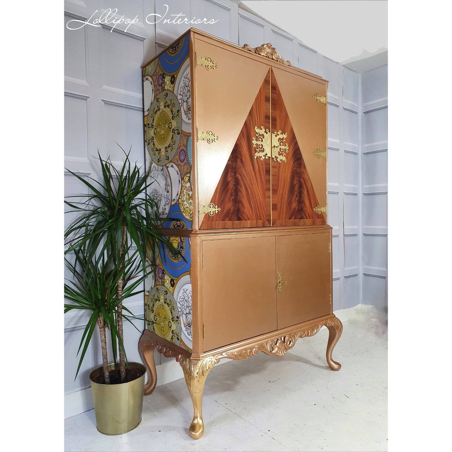 Image of Gold cocktail cabinet with versace wallpaper 