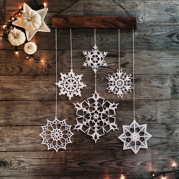 Image of Elegant Christmas decoration - snowflakes and wood mobile