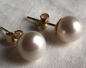 7.3mm White Pearl Earrings On Gold Backs.