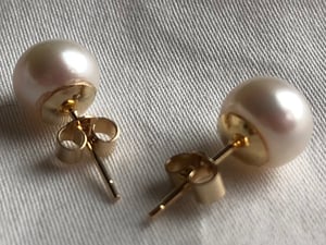 7.3mm White Pearl Earrings On Gold Backs.