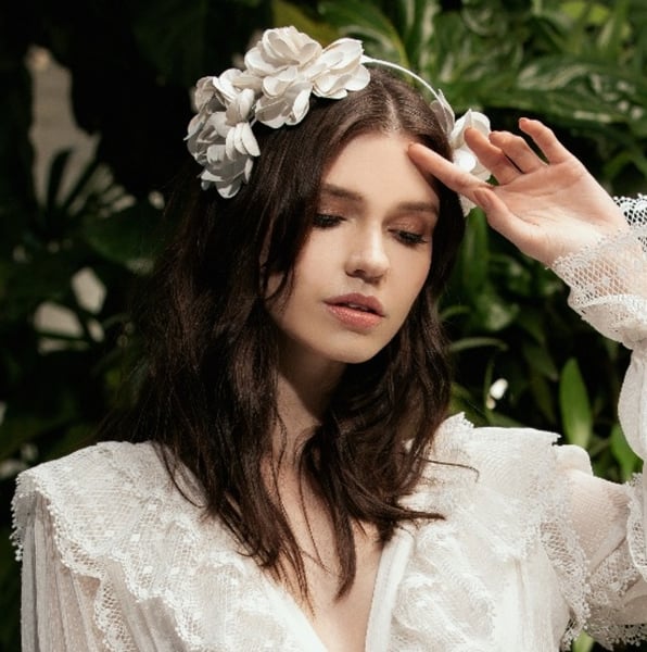 Image of White floral head band.